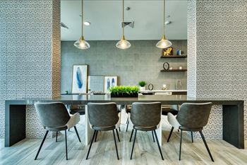 a dining room with a large table and chairs